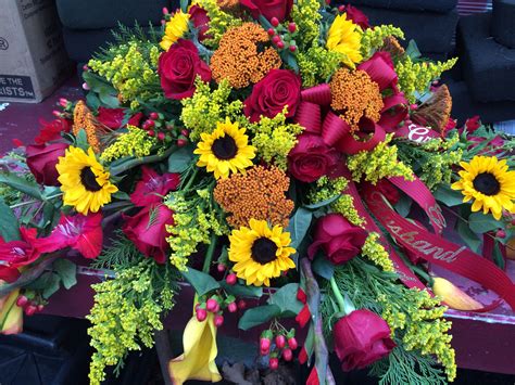 Flowers for the casket are a beautiful and elegant way to convey your heartfelt sympathies. Casket piece with sunflowers, yarrow, roses, solidago and ...