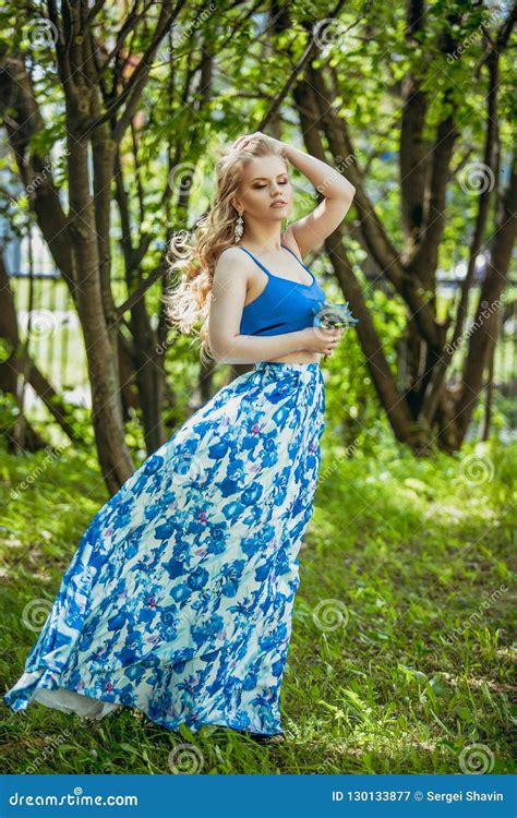 Beautiful Young Girl In A Summer Dress At Sunset Fashion Photo In The Forest Stock Image