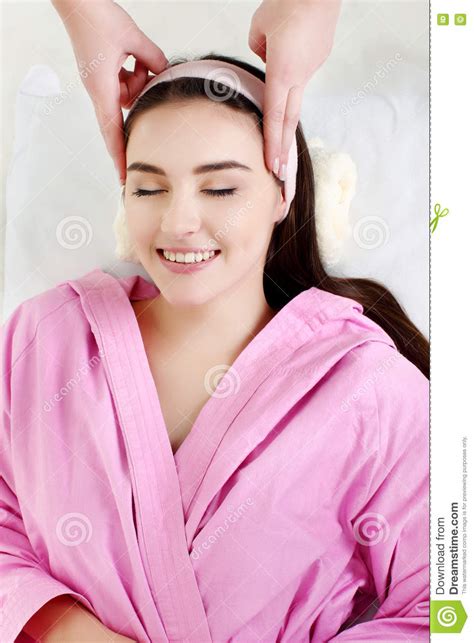 Young Woman Receiving Facial Massage With Closed Eyes In A Spa S Stock Image Image Of