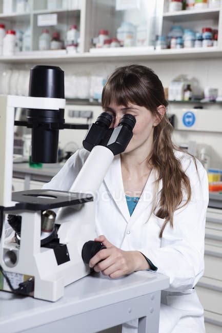 Scientist Working With Microscope — Munich Bottle Stock Photo