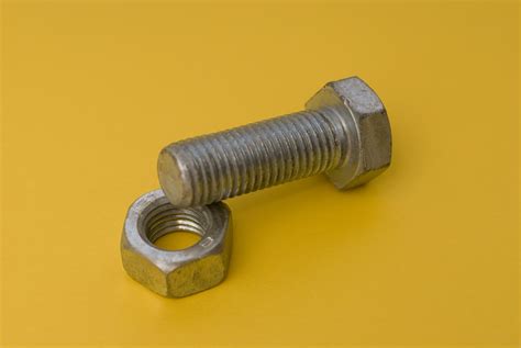 A Bolt With A Hex Nut On Yellow 3833 Stockarch Free Stock Photos