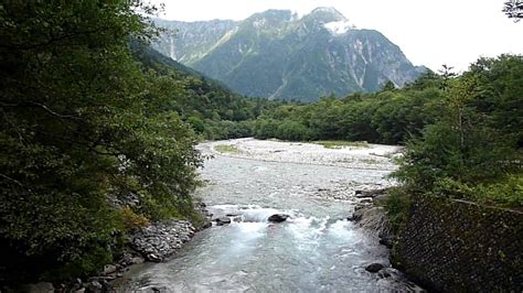A river is a natural waterway that conveys water derived from precipitation from higher ground to lower levels. Azusa river - Kamikochi - YouTube