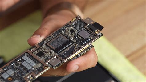 First M2 Macbook Air Teardown Reveals Jam Packed Motherboard And Extra