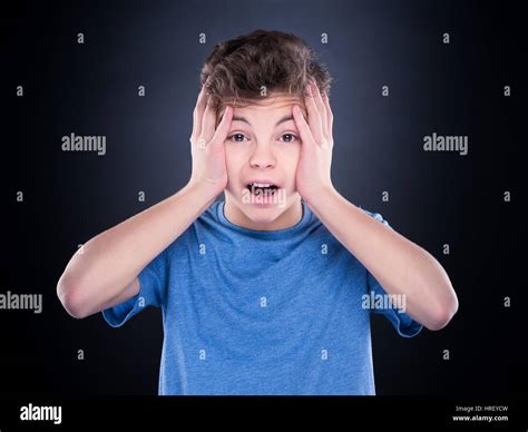Emotional Portrait Of Caucasian Teen Boy Amazed Teenager Screaming