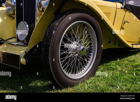 Classic Antique Car In Cream White Color On The Outdoor Grass The