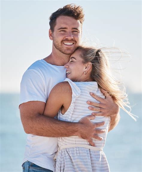 Love Beach Hug And Couple Smile On Romantic Ocean Holiday Trip