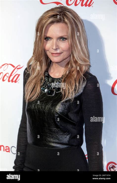 Michelle Pfeiffer Wears A Black Top Black Skirt And Black High Heels