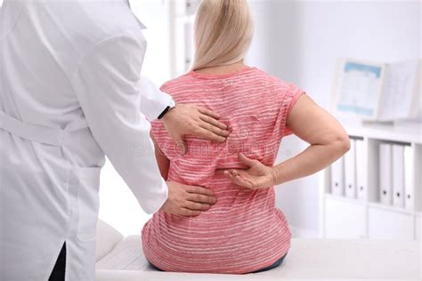 Chiropractor Examining Patient With Back Pain Stock Image Image Of Physical Examining