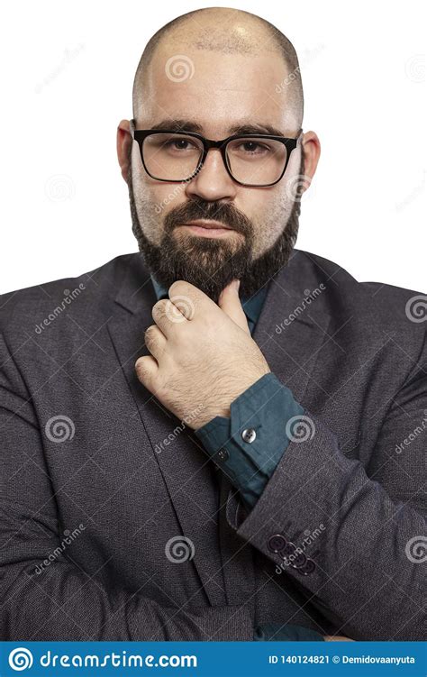 Serious Young Bald Man In Glasses With A Beard Close Up Isolated On A