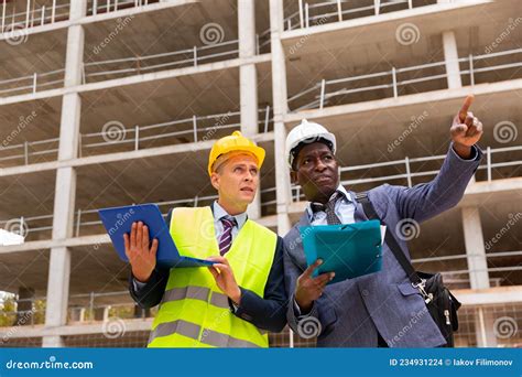 African American Architect And An Engineer Controlling The Progress Of
