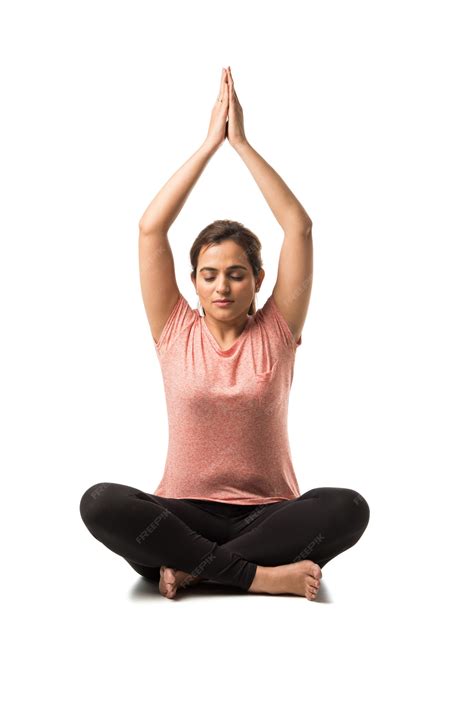 Premium Photo Indian Woman Or Girl Performing Yoga Asana Or Meditation Or Dhyana Sitting