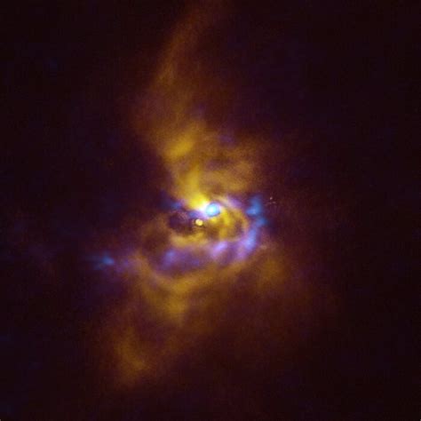 An Image Of Dust Clumps Near A Young Star Reveals Clues About The