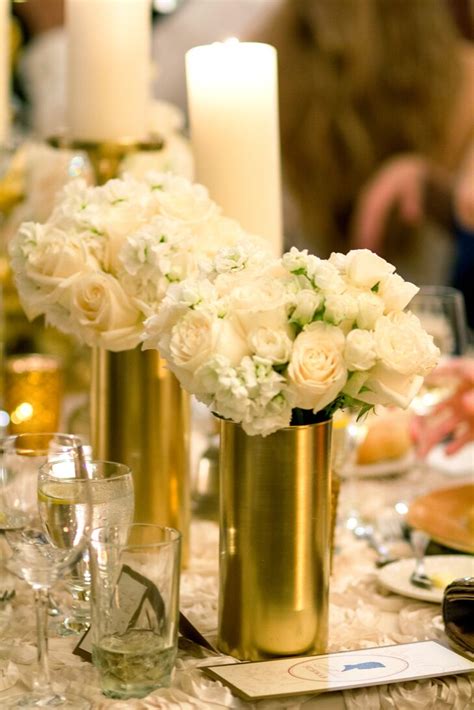 White Rose And Hydrangea Centerpieces In Gold Vases