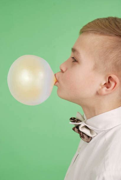 Royalty Free A Man Blowing A Bubble From Chewing Gum Pictures Images