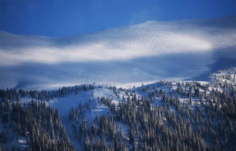 Full Moon Rising Behind A Snowy Mountain Stock Image Image Of Arctic