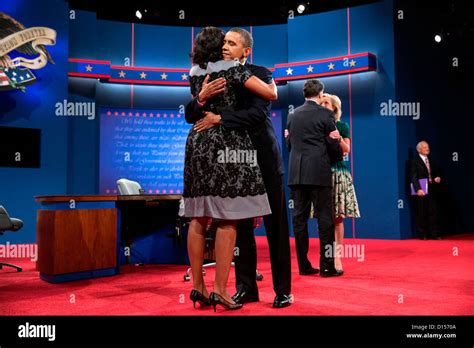 Us President Barack Obama Hugs First Lady Michelle Obama Following The