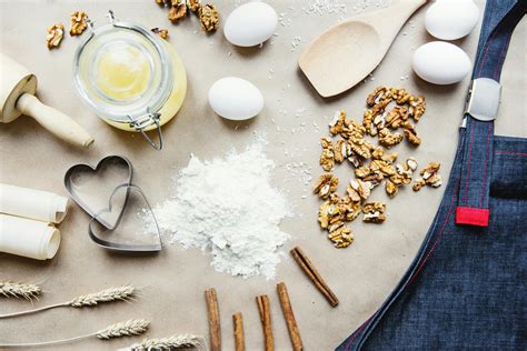 Composition Of Baking Ingredients With Apron In Kitchen · Free Stock Photo