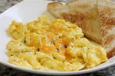 Learn more about how many eggs you should eat here. The Best Cheesy Eggs - Scrambled Eggs with Lots of Cheddar Cheese