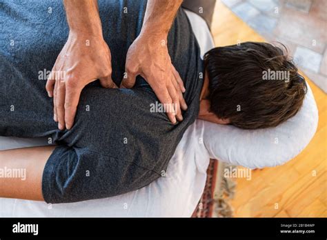 Therapist Doing Back Massaging To Strong Sportsman A Male Patient Receiving Treating