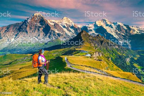 Mannlichen Tourist Station With Backpacker Hiker Woman Grindelwald