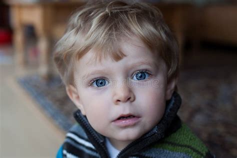 Adorable Baby Boy With Blue Eyes And Blond Hairs Stock Photo Image