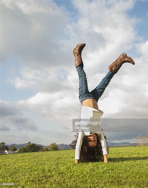 Mixed Race Girl Doing Cartwheel High Res Stock Photo Getty Images