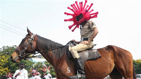 Police In India Raise Coronavirus Awareness With Virus Costumes While