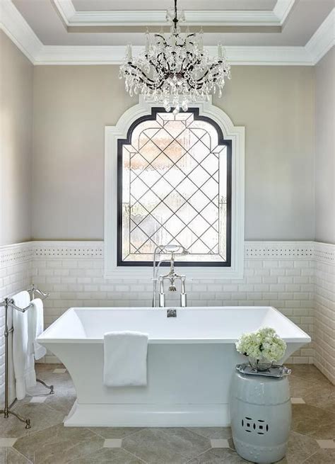 Luxurious French Bathroom Features A French Crystal Chandelier Hung