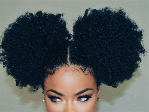 A tight and smooth bun is a classic look, which is always adorned by top models on runways. Pom poms | two high buns on natural hair # ...