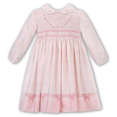 Sarah Louise Girls Peach Smocked Dress 011677