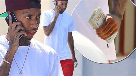 Tyga Looks Stacked With Cash As He Carries Fistfuls Of Bills