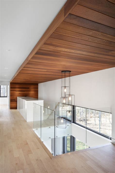 Features wide plank wood cladding that is prefinished and available in solid & engineered construction. KL House: A Contemporary Home in the Forest in Quebec ...