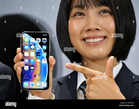 Japanese Actress Honoka Matsumoto Poses For Camera During A Launch Event For Apple New Iphone Xs