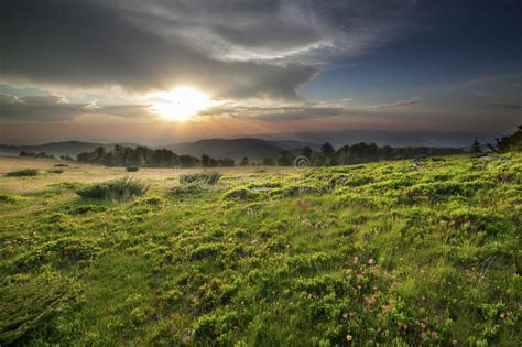 Dramatic Sunset Over Green Field Stock Photo Image Of Country Cloudy