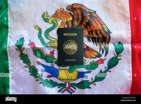 Mexican Passport On A Mexican Flag Background Stock Photo Alamy