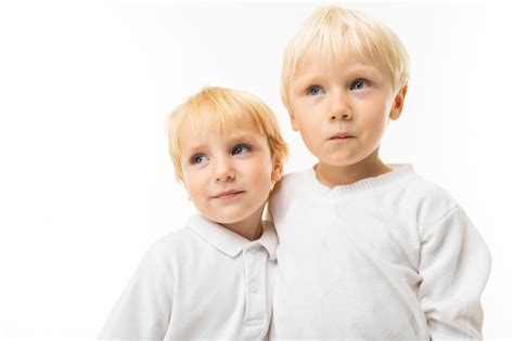 Premium Photo Two Little Caucasian Brothers With Blonde And Fair Red