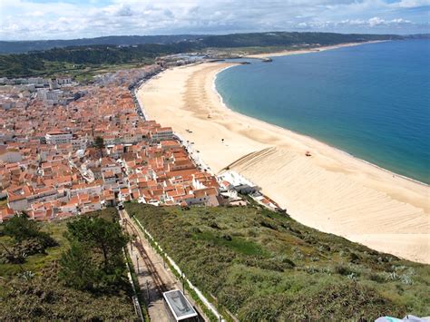 There are 4 ways to get from coimbra to nazaré by bus, train, taxi or car. Nazare-Portugal-from-Sitio - Packing Light Travel