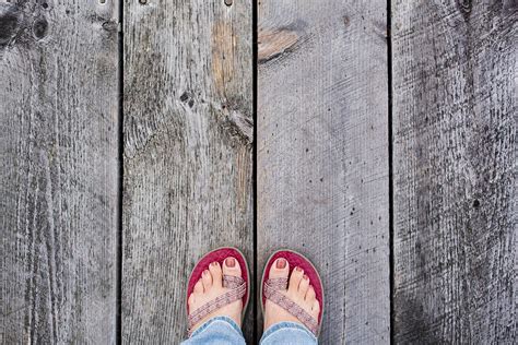 View Woman S Feet Standing On A Dock By Stocksy Contributor Holly Clark Stocksy