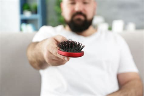 Adult Man With Hair Brush At Home Closeup Hamodia