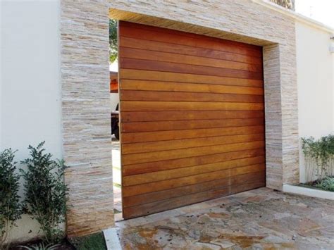 A Large Wooden Garage Door In Front Of A House