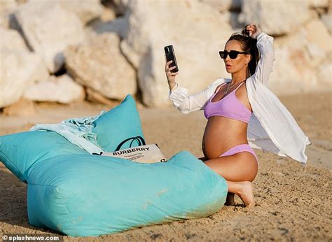 Pregnant Lauryn Goodman Shows Off Her Baby Bump In A Bikini On The