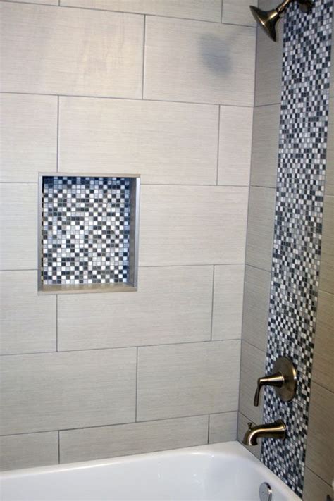I was in olympia tile this week with a client picking tile for her bathroom. Bathroom shower with gray and white square mosaic and 12 ...