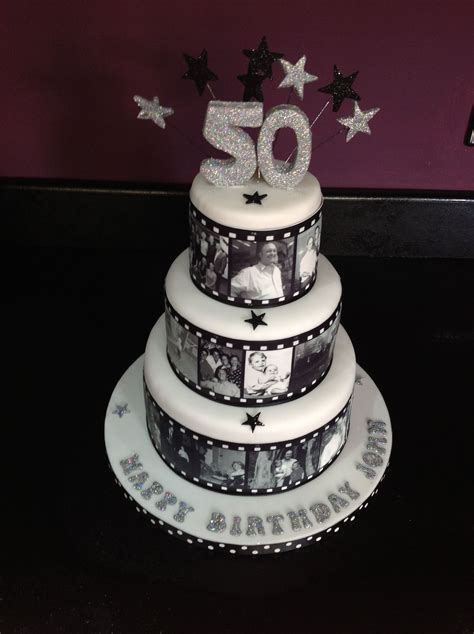 A 50th Birthday Cake With The Number 50 On Top And Stars Around It In Black And White