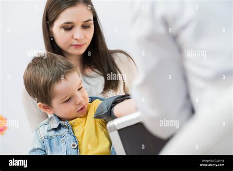 Little Boy Medical Visit Doctor Measuring Blood Pressure Of A Child