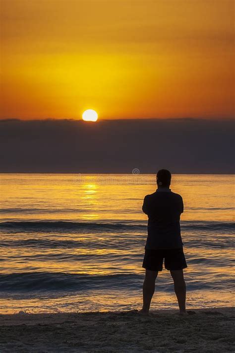 Man Standing Sunrise Sunset Beach Contemplation Stock Photo Image Of