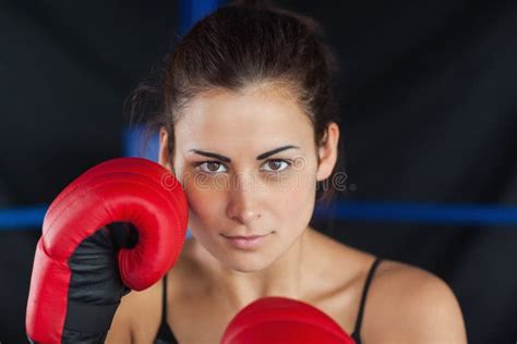 Close Up Portrait Of A Beautiful Woman In Red Boxing Gloves Stock Image