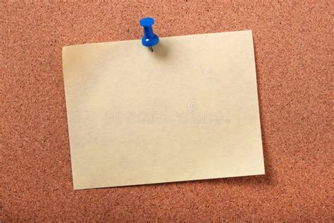 Single Yellow Sticky Post Note Pinned Pushpin Cork Board Background