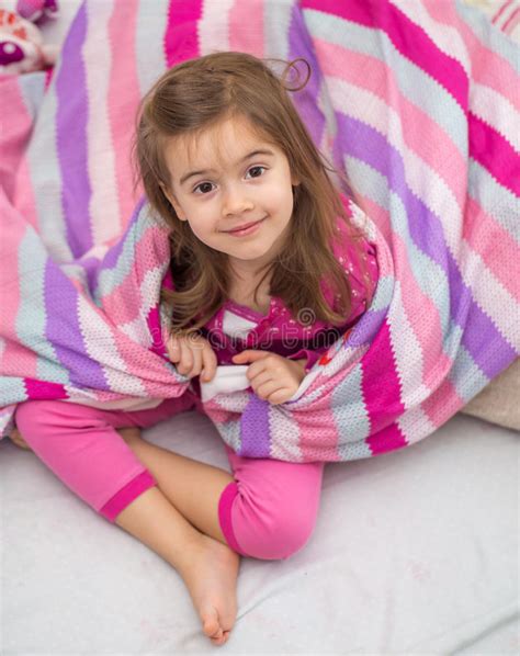 A Little Girl With A Blanket In Bed Stock Photo Image Of