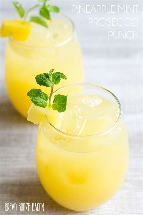 Two Glasses Filled With Lemonade And Garnished With Mint