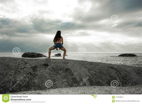 Woman Bending On A Rock At Sunset On Bakovern Beach Cape Town Stock Photo Image Of Seascape